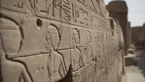 Karnak Temple Hieroglyphic icons and Pharaohs on wall, Luxor City, Egypt. Stock Footage