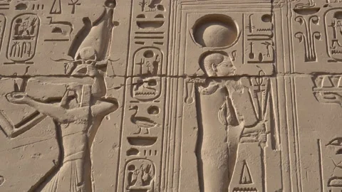 Karnak temple large hieroglyphic wall with gods and pharoah Stock-Footage 166102749