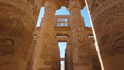 Karnak Temple in Luxor, Egypt. Camera moves between majestic columns with Video stock 237880306