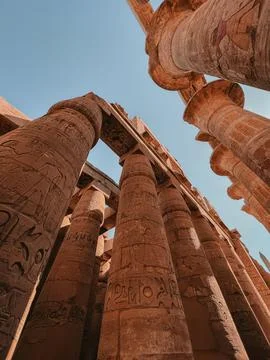 KARNAK TEMPLE - Massive columns inside beautiful Egyptian landmark with Stock Photos