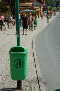 KARPACZ, POLAND - AUGUST 14: Unidentified people and dustbin on main street i Stock Photos