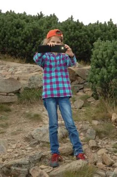 KARPACZ, POLAND - AUGUST 15: Unidentified girl taking picture with her smartp Stock Photos