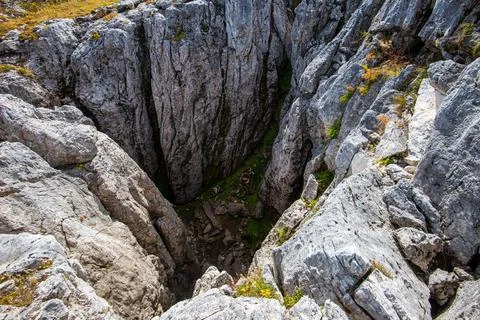 Karst funnel in mountains Stock Photos