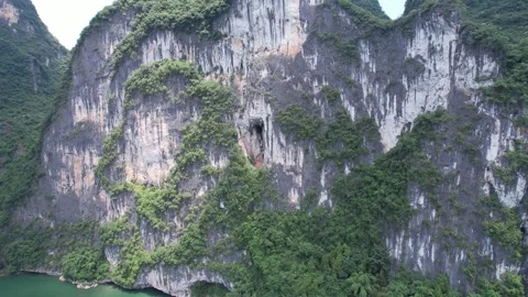 Karst mountain landscape with a cave opening along the li river in guilin Stock Footage 341939742