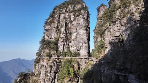 Karst mountain landscape with towering cliffs &amp; walking trail in southern China Vídeos de archivo 295046341