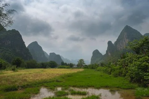 Karst mountains and clouds Stock Photos