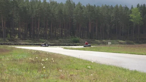 Kart Racing and a driver passing by Stock Footage 239579950