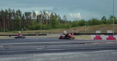 Karts passing zigzag turn Stock Footage 244921805