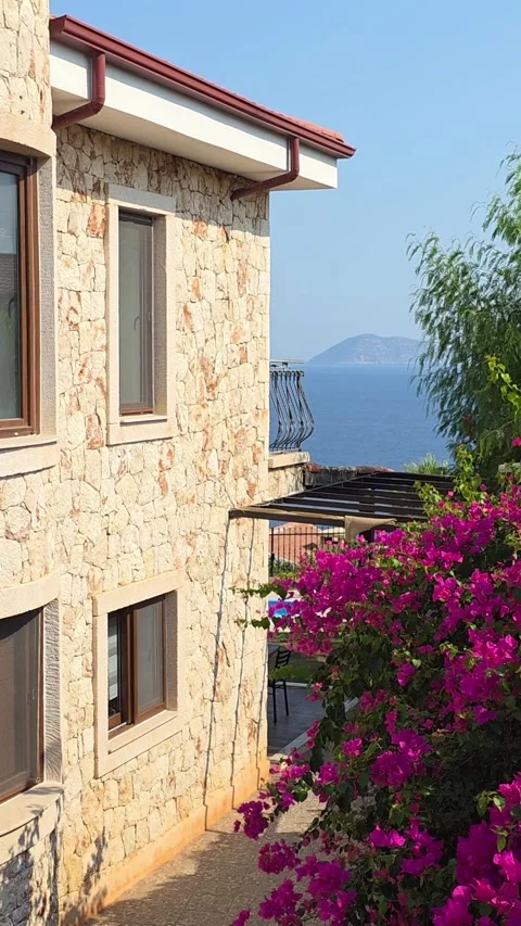 Kas, Turkey - August 23, 2026 Stone villa, flowers and sea view Stock Footage 345145265