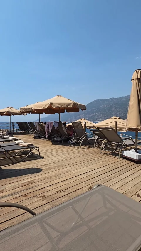 Kas, Turkey - August 23, 2026 Lighthouse Hotel beach pan view Stock Footage 345145649