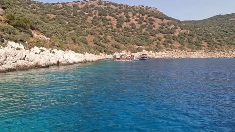 Kas, Turkey - August 25, 2026 Boats anchored in a hidden bay Stock Footage 344648373