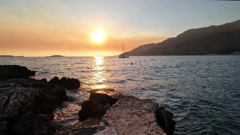 Kas, Turkey - August 29, 2026 Sunset over sea and rocky coast Stock Footage 345139141
