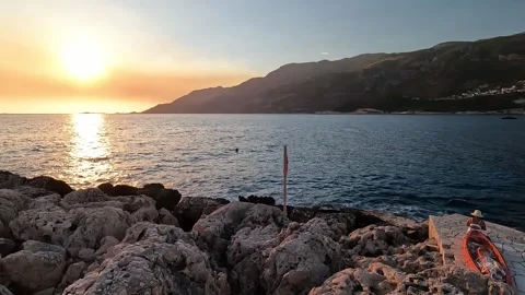 Kas, Turkey - August 29, 2026 Rocky coast, sunset and boat Stock Footage 345139252