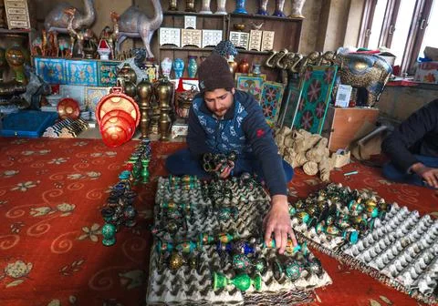 Kashmiri artisans make Christmas items from papier mache in Srinagar, India - 18 Stock Photos