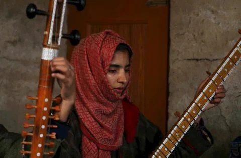 Kashmiri Muslim girls play instruments and sing Sufi music in Kashmir, Shilwat,  Stock Photos