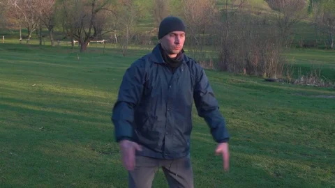 Kata Karate is Practicing Man in the Hat Early in the Morning in the Woods Stock Footage 74693255