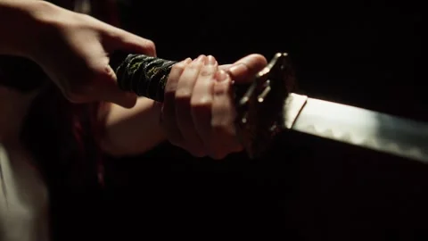 Katana wielded by female hands Stock Footage 314857934