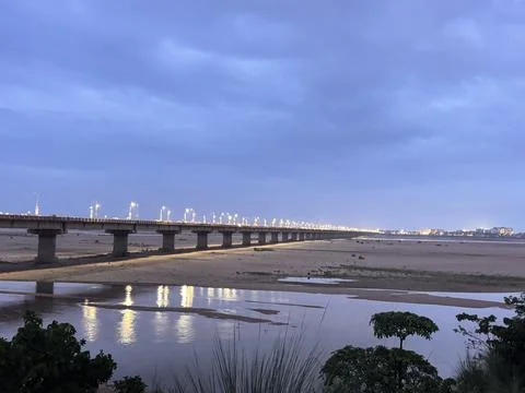 Kathajodi Bridge at Sunset with River Reflections in Cuttack, Odisha, India Stock Photos