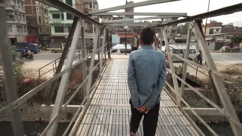 Kathmandu- crossing a bridge Stock Footage 82518158