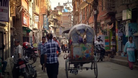 KATHMANDU,NEPAL - 23 SEPTEMBER 2017: Crowded Thamel Street Centre of Tourism Stock Footage 94706492