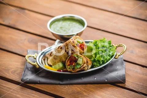 Kati roll traditional indian cuisine sauce towel kitchen cafe restaurant top Stock-Fotos