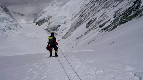Katmandou, Nepal - 1 March 2018 - A man walking on the glacier Stock Footage 139192541