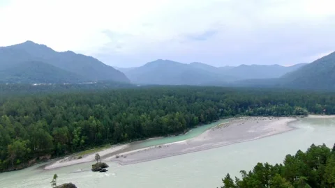 Katun River and endless forests against background of mountains in haze in Altai Stock Footage 143478162