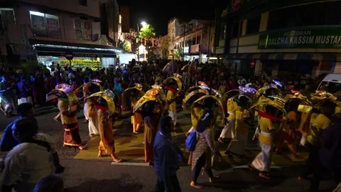 Kavadi bearer dances in devotion during religious ceremony. Stock Footage 318261313