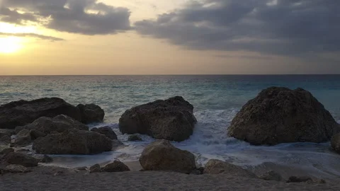 Kavalikefta Beach at sunset with waves on the beach. Lefkada. Greece. Stock Footage 255382214