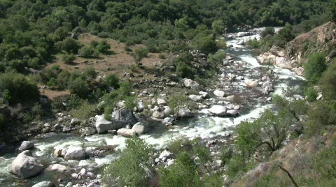 Kaweah River flows downstream through the rocks, creating whitewater rapids Stock Footage 360281