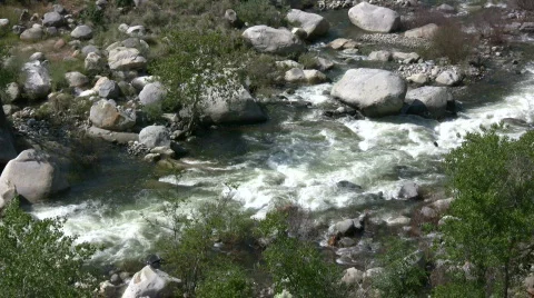 Kaweah River flows downstream through the rocks, creating whitewater rapids Stock Footage 360332
