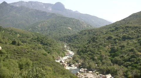 Kaweah River flows downstream through the rocks, creating whitewater rapids Stock Footage 360335
