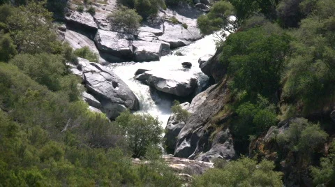 Kaweah River flows downstream through the rocks, creating whitewater rapids Stock Footage 360338