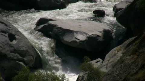 Kaweah River flows downstream through the rocks, creating whitewater rapids Stock Footage 360339