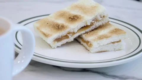Kaya Toast featuring crispy toasted bread filled with kaya coconut jam and Stock Footage 339048792