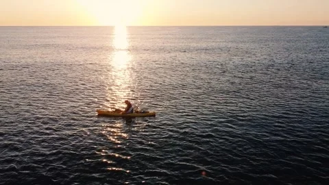 Kayak at the beach drone aerial view. Kayaker trolling fishing Vídeos de archivo 241237672