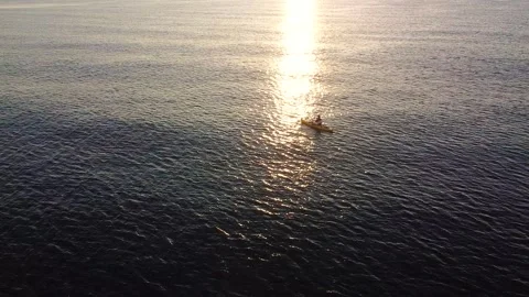 Kayak at the beach drone aerial view. Kayaker trolling fishing Видео 241237800