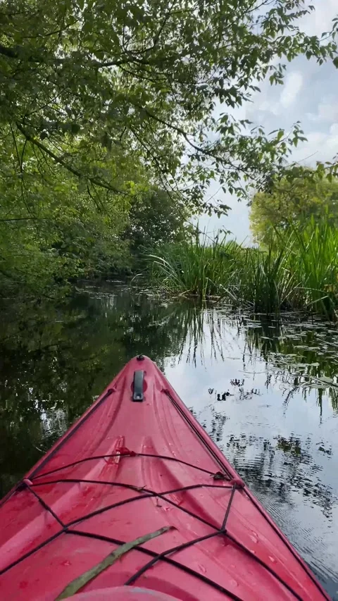 A kayak floats down the river. Vertical video Stock Footage 282200775