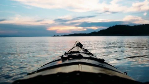 Kayak prow at sunset Stock Footage 76983477