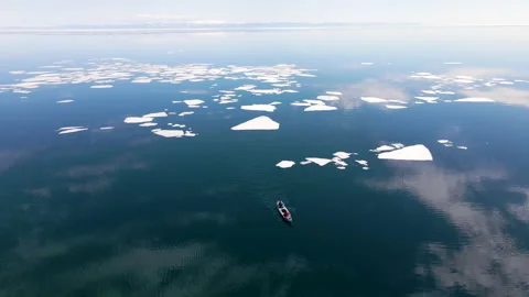 Kayak sailing between ice floes on Baikal lake in spring. Stock Footage 155221537
