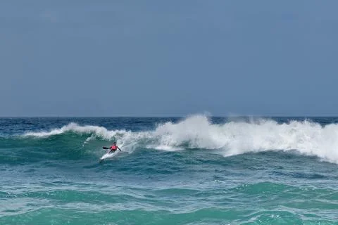 Kayak surfing huge waves Stock Photos