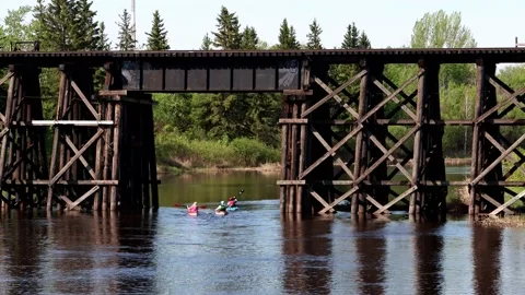 Kayak Underneath Trestle Bridge Stock Footage 131476373