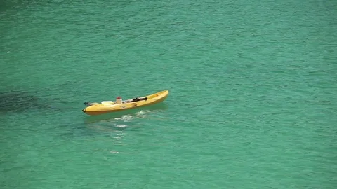 Kayak on the waves near the beach n a provincial town Porto Cristo. Mallorca Stock Footage 75659270