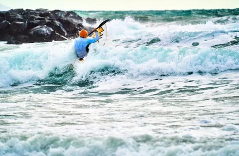 Kayaker collides with the waves Stock Photos