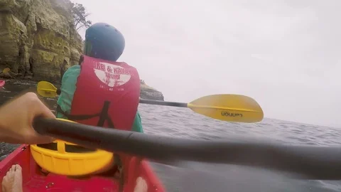 Kayaker Explore La Jolla Cove Sea Caves - GoPro POV Stock Footage 90066864