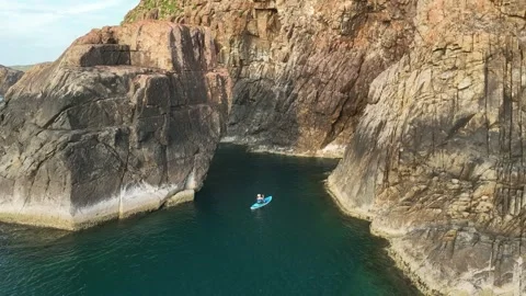 Kayaker Exploring Rocky Cove at Eo Gio, Quy Nhon, Vietnam Stock Footage 337891448