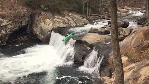 Kayaker going over waterfall Stock Footage 102868138