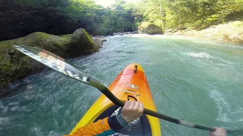 Kayaker kayaking in powerful river rapids Stock Footage 72505335