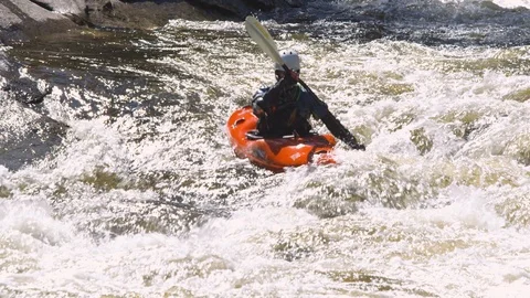 Kayaker kayaking in the speeding river Stock Footage 103825211