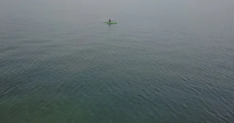 KAYAKER ON A LAKE Stock Footage 127887333